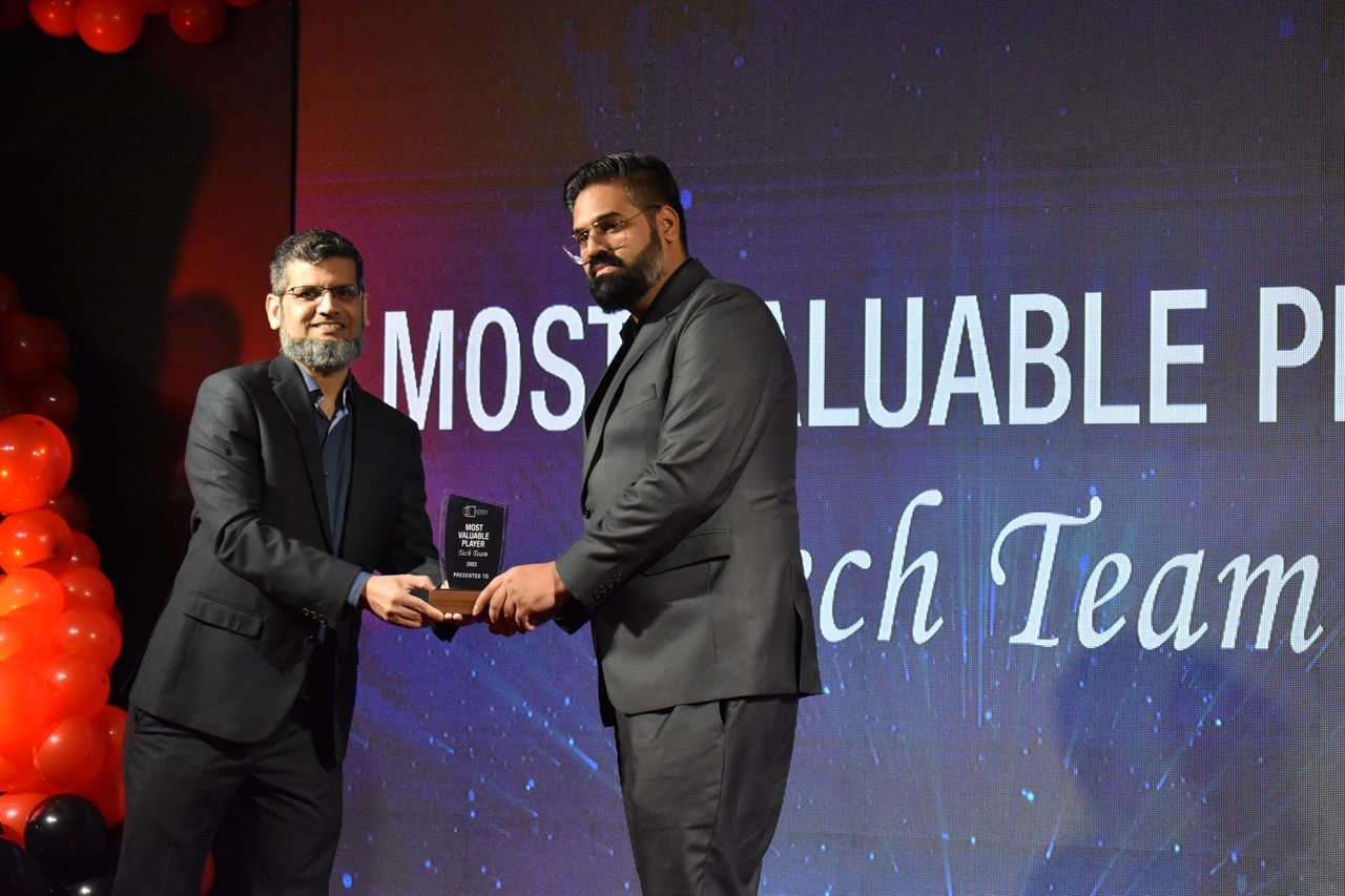 Mughees Ahmad receiving the 2023 Most Valuable Player award for the Tech Team